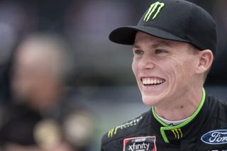 NASCAR Xfinity Series driver Riley Herbst (98) smiles prior to the NASCAR Xfinity auto racing race at the Charlotte Motor Speedway Saturday, Oct. 9, 2021, in Concord, N.C. (AP Photo/Matt Kelley)