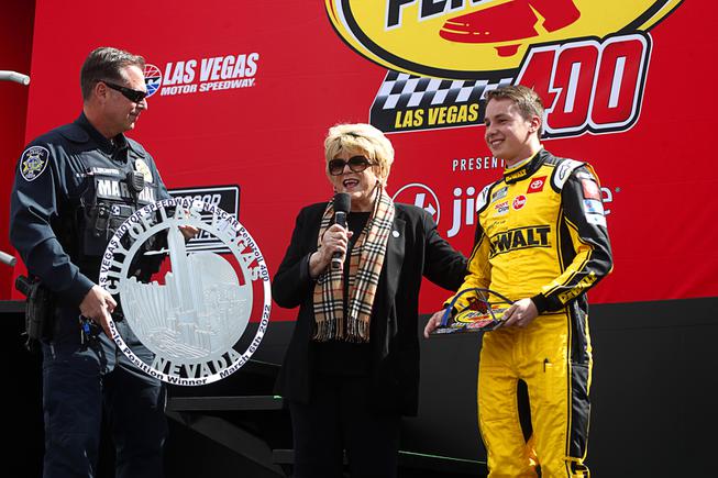 Las Vegas Mayor Carolyn Goodman makes a presentation to pole leader NASCAR Cup Series driver Christopher Bell during the 25th annual Pennzoil 400 NASCAR Cup Series race at the Las Vegas Motor Speedway Sunday, March 6, 2022.