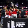 UNLV Lady Rebels and UNLV Lady Rebels head coach Lindy La Rocque celebrate with the trophy after their 75-65 victory over the Colorado State Rams in the Mountain West womens championship game at the Thomas & Mack Center Wednesday, March 9, 2022.
