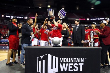 UNLV Lady Rebels and UNLV Lady Rebels head coach Lindy La Rocque celebrate with the trophy after their 75-65 victory over the Colorado State Rams in the Mountain West womens championship game at the Thomas & Mack Center Wednesday, March 9, 2022.