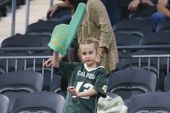 A young Cal Poly Mustangs fan cheers on her team ...