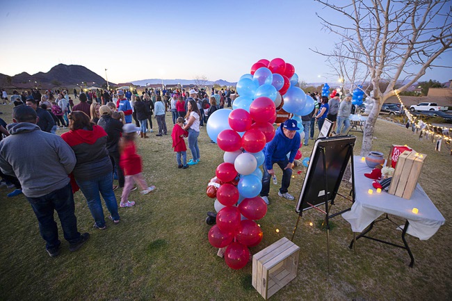 Rodney Burr, right, Rex Patchetts grandfather, looks over a display during a Celebration of Life for Rex Patchett at Paradise Pointe Park in Henderson Friday, March 11, 2022. Patchett, 13, was killed by a motorist who lost control of his car in front of Mannion Middle School on Monday, March 7.