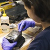 A worker polishes a coining dye, a metal piece used for imprinting onto a coin, at Sunshine Minting Inc in Henderson Friday, March 18, 2022.