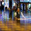 In this June 24, 2021, photo, a dealer distributes cards to gamblers at Resorts World Las Vegas.