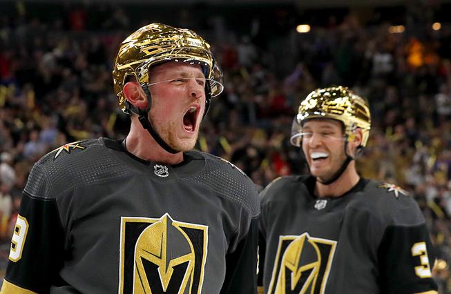 Vegas Golden Knights center Jack Eichel (9) celebrates with defenseman Brayden McNabb (3) after scoring during the first period of an NHL hockey game against the Vancouver Canucks at T-Mobile Arena Wednesday, April 6, 2022.