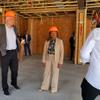 Nevada Gov. Steve Sisolak and Adrianne Todman, U.S. Department of Housing and Urban Development deputy secretary, tour a construction site of affordable housing units in southwest Las Vegas Thursday, April 14, 2022. Project Manager Jess Molasky Is at right.