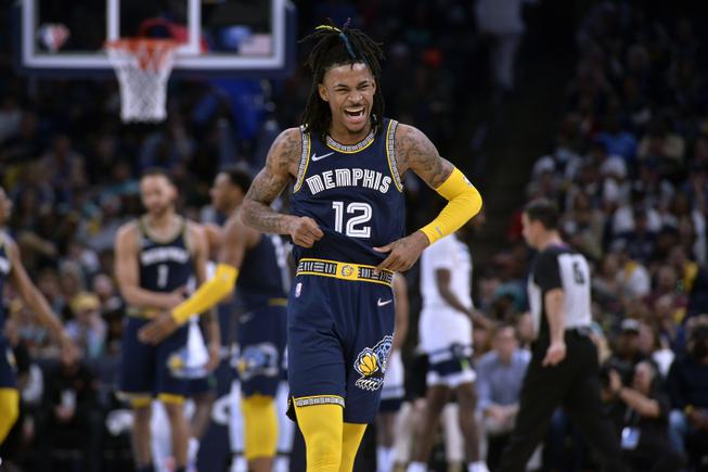 Memphis Grizzlies guard Ja Morant (12) reacts during the second half of Game 2 against the Minnesota Timberwolves on Tuesday, April 19, 2022, in Memphis, Tenn. 

