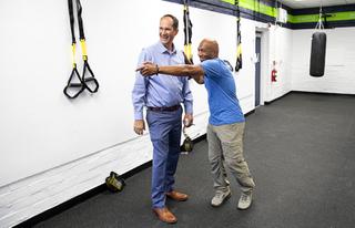 Jeff Horn, left, executive director of the Clark County Association of School Administrators and Professional-Technical Employees, and Frank Slaughter look over equipment in the Slaughter House fitness room at Mission High School Wednesday, April 20, 2022.