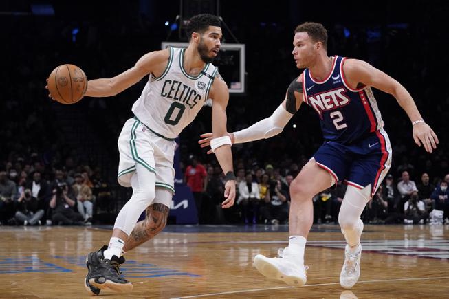 Boston Celtics forward Jayson Tatum (0) drives against Brooklyn Nets forward Blake Griffin (2) during the second half Monday, April 25, 2022, in New York. 


