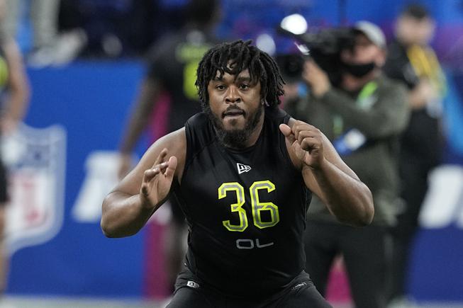 Memphis offensive lineman Dylan Parham runs a drill during the NFL football scouting combine, Friday, March 4, 2022, in Indianapolis.