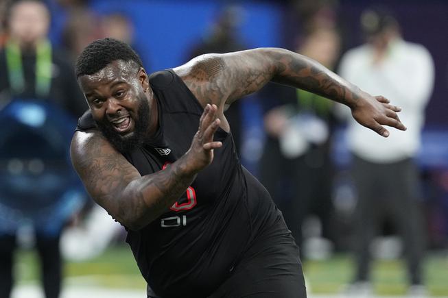 LSU defensive lineman Neil Farrell runs a drill during the NFL football scouting combine, Saturday, March 5, 2022, in Indianapolis.