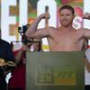 Canelo Alvarez poses during a ceremonial boxing weigh-in, Friday, May 6, 2022, in Las Vegas. Alvarez is scheduled to fight Dmitry Bivol Saturday in Las Vegas.