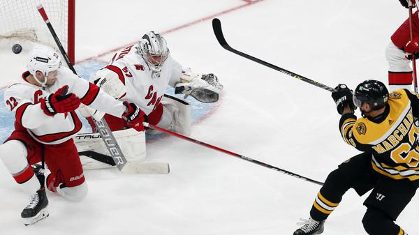 Marchand, Swayman give Bruins 4-2 win, Canes lead series 2-1