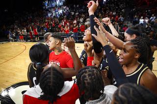 Las Vegas Aces celebrate their 85-74 victory over the Seattle Storm at the Michelob Ultra Arena Sunday, May 8, 2022.