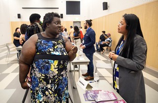 Amore Blakemore, left, talks with candidate Brenda Zamora during a candidate forum for CCSD School Board District D candidates at the East Las Vegas Library Thursday, May 5, 2022. The forum was organized by the Clark County Conservative Coalition and Vote Nevada.