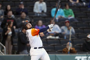 Aviators catcher Shea Langeliers (33) hustles down the line during a minor  league baseball game …