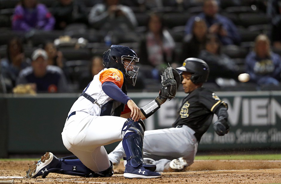 Aviators catcher Shea Langeliers (33) hustles down the line during a minor  league baseball game …