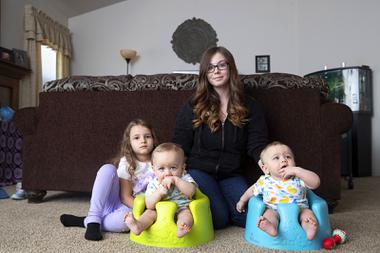 Taylor Phelps poses with her seven-month-old twin boys Damyan and Adryan and her daughter Elyana, 5, at her mothers home Wednesday, May 11, 2022. The twins need a high-calorie baby formula that can be hard to find recently due to a baby formula shortage.
