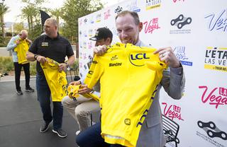 Clark County Commissioner Justin Jones poses with a yellow jersey during a news conference for the L'Etape Las Vegas by Tour de France at the Las Vegas Ballpark in Summerlin Thursday, May 12, 2022. Officials officially announced event which will come to Las Vegas in 2023.