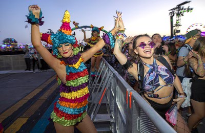 Tiffany Iverson of Greenville, N.C. dances with a performer in Kinetic Field during the first night of EDC Las Vegas 2022 at the Las Vegas Motor Speedway Friday, May 20, 2022.