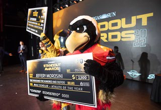 Mascots from Las Vegas teams arrive on stage with $2,500 checks for the male and female scholar-athletes during the Las Vegas Sun Standout Awards in the South Point Showroom Tuesday, May 24, 2022. Risk, the mascot for the Vegas Knight Hawks is at center.