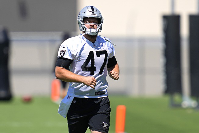 Las Vegas Raiders' Trent Sieg warms up at the NFL football team's