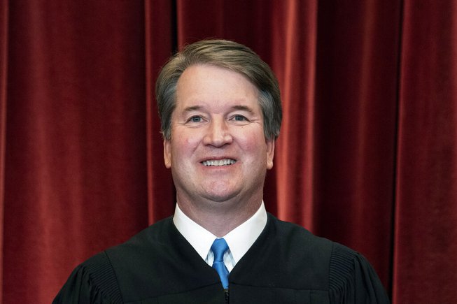 Associate Justice Brett Kavanaugh stands during a group photo at the Supreme Court in Washington, on April 23, 2021.