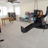 Stephanie Bullock, a realtor with Signature Real Estate Group, tries out a hanging chair as she shows a home to Mark Dhaemers in a residential area near Wigwam Avenue and Buffalo Drive Thursday, June 9, 2022.