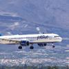 A JetBlue passenger jet lands at Harry Reid International Airport June 9, 2022.