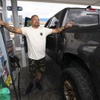 Napoleon Sharble of Sacramento, Calif. stands by his pickup truck after filling up at a gas station in Jean, Nev. Wednesday, June 22, 2022.