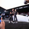 Janel Rios, 11, and driver Austin Hauge pose in front of a Lamborghini Huracan Spyder on the auction stage as Barrett-Jackson kicks off its 2022 Las Vegas Auction by partnering with the Driven Project, which provides supercar therapy for children battling critical illnesses, at the West Hall of the Las Vegas Convention Center Thursday, June 30, 2022.