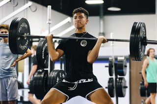 Furian Inferrera, 14, does a power clean during training at Game Changers Wednesday, June 29, 2022.