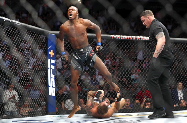 Lightweight fighter Jalin Turner celebrates after submitting Brad Riddell in the first round during UFC 276 at T-Mobile Arena Saturday July 2, 2022. 