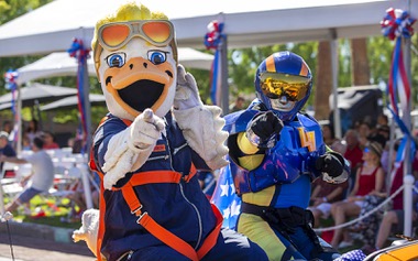 Spruce the Goose and the Aviator, mascots of the Aviators baseball team, ride in a Howard Hughes Corporation entry, during the annual Summerlin Council Patriotic Parade Monday, July 4, 2022.
