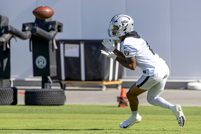 Las Vegas Raiders wide receiver Tyron Johnson  (1) catches a pass during training camp at the Las Vegas Raiders Headquarters/Intermountain Healthcare Performance Center in Henderson, Thursday, July 21, 2022.