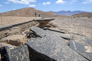 Damage is shown on Daylight Pass Road in Death Valley National Park Tuesday, Aug. 9, 2022. Heavy rainfall from a storm on Friday, Aug. 5, stranded visitors and damaged roads, forcing a temporary closure of the park.