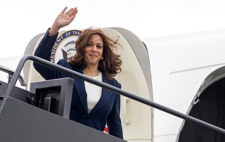 Vice President Kamala Harris waves before departing at Harry Reid International Airport Wednesday, Aug. 10, 2022.