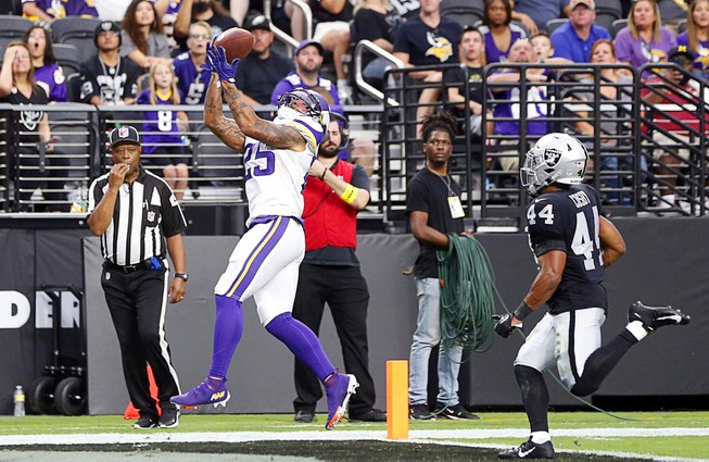 Minnesota Vikings wide receiver Albert Wilson (25) makes a catch in the end zone ahead of Las Vegas Raiders cornerback Bryce Cosby (44) during an NFL preseason game at Allegiant Stadium Sunday, Aug. 14, 2022.