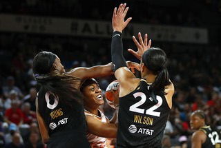 Phoenix Mercury forward Kristine Anigwe (33) is shut down by Las Vegas Aces guard Jackie Young (0) and forward A'ja Wilson (22) during an WNBA playoff game at the Michelob Ultra Arena at Mandalay Bay Wednesday, Aug. 17, 2022.