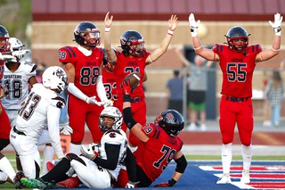 Coronados Connor Pantelas-Hemmers (79) celebrates with teammates after scoring a touchdown during the first half of a game against the Cimarron-Memorial Spartans at Coronado in Henderson Friday, Aug. 19, 2022.