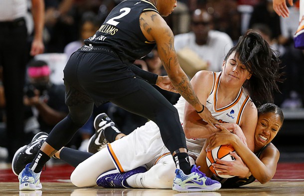 Las Vegas Aces center Iliana Rupert, right, fights with Phoenix Mercury center Megan Gustafson (10) for a loose ball during the first half in Game 2 of a WNBA basketball first-round playoff series at the Michelob Ultra Arena in Mandalay Bay Saturday, Aug. 20, 2022 Las Vegas Aces guard Riquna Williams (2) is at left. STEVE MARCUS