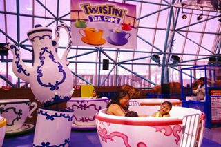 People ride in the Twistin Tea Cups at The Adventuredome Tuesday, Aug. 30, 2022.