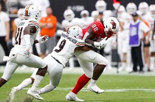UNLV Rebels tight end Shelton Zeon III (88) is tackled by Idaho State Bengals safety Quantraill Morris-Walker (9) during the first half of an NCAA college football game at Allegiant Stadium Saturday, Aug. 27, 2022, in Las Vegas. Idaho State Bengals cornerback Jihad Brown (21) is at left.