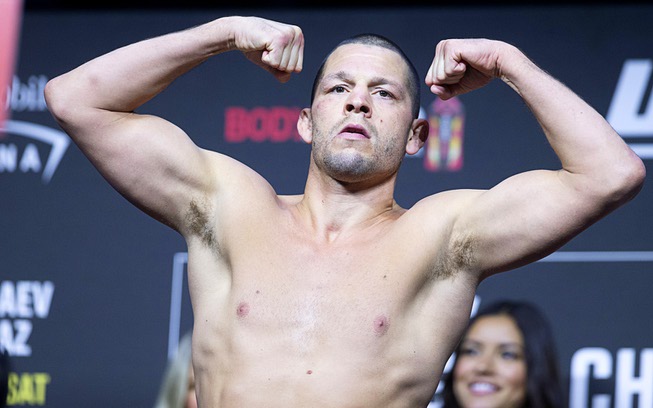 Welterweight fighter Nate Diaz poses during a ceremonial weigh-in for the UFC 279 mixed martial arts event Friday, Sept. 9, 2022, in Las Vegas. Diaz is scheduled to fight Tony Ferguson, a replacement for Khamzat Chimaev who came in 7.5 lbs. overweight, at UFC 279 Saturday.