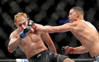 Tony Ferguson, left, takes a punt from Nate Diaz in a welterweight fight during UFC 279 at T-Mobile Arena Saturday, Sept. 10, 2022.