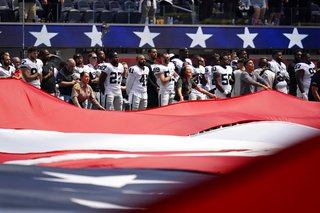 Las Vegas Raiders players stand during the national anthem before an NFL football game against the Los Angeles Chargers in Inglewood, Calif., Sunday, Sept. 11, 2022. 





