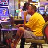 A gambler plays a slot machine in a smoking section of the Hard Rock casino in Atlantic City, N.J on Aug. 8, 2022. 