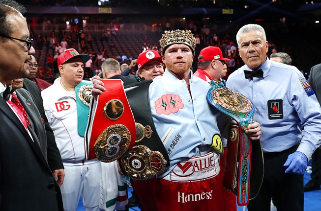 Undisputed super middleweight champion Canelo Alvarez poses after defeating Gennadiy ...