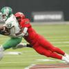North Texas running back Oscar Adaway III (27) is tackled by UNLV inside linebacker Fred Thompkins (10) during the first half of their game at Allegiant Stadium Saturday Sept. 17, 2022.