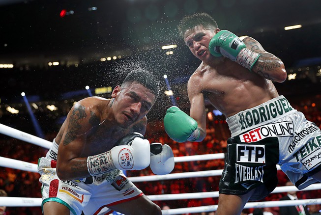 WBC super flyweight champion Jesse Rodriguez, right, lands a punch ...